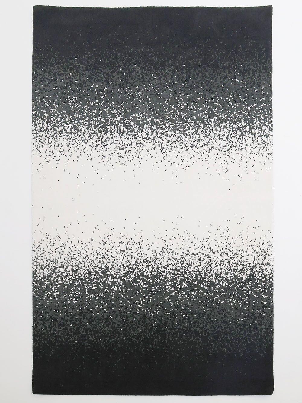 The RAMSHA HOME Rectangle Multi Color Rug - CMN 71 (200x300cm) is a machine-made area rug with an ombre gradient, blending solid black edges to a white center and featuring a speckled pattern throughout.