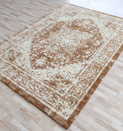 The RAMSHA HOME Traditional Brown Medallion Novara Carpet - CMN 91 (170x240cm) features a distressed beige and brown medallion pattern with an ornate border, adding timeless style to any light wood floor.