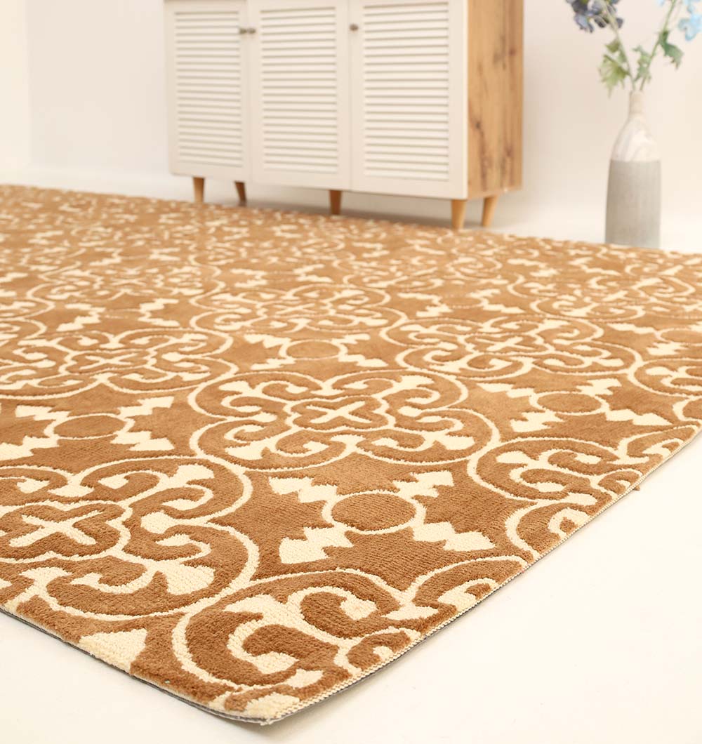 The RAMSHA HOME Moroccan Trellis Medallion Brown & Ivory Rug – CMN 93 adds warmth to this minimalist room, enhanced by a white cabinet and a floral vase in the background.