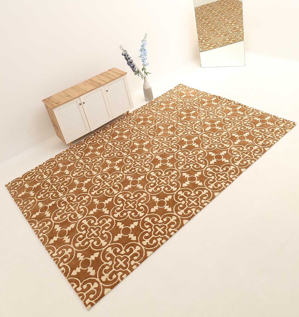 The RAMSHA HOME Moroccan Trellis Medallion Brown & Ivory Rug (CMN 93) lies on a light floor, with a small wooden cabinet, a tall vase of blue and white flowers, and a large mirror against the wall in this minimal modern room.