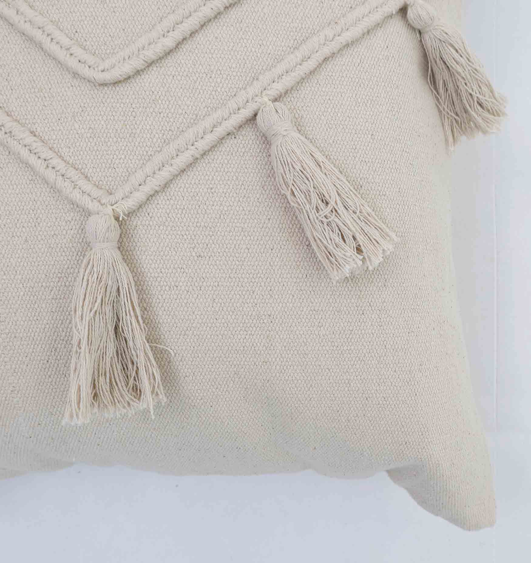 Close-up of the Ramsha Home CS 294 Natural Color Cushion (45x45cm), featuring decorative tassels and textured zigzag stitching—this elegant cushion adds charm to any space.