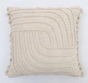 The Natural Color Cushion - CS 295 (45x45cm) by Ramsha Home features cream tones, a textured geometric design with raised curved lines, and short frayed tassels along the edges. Perfect for elegant decor from a luxury UAE brand.