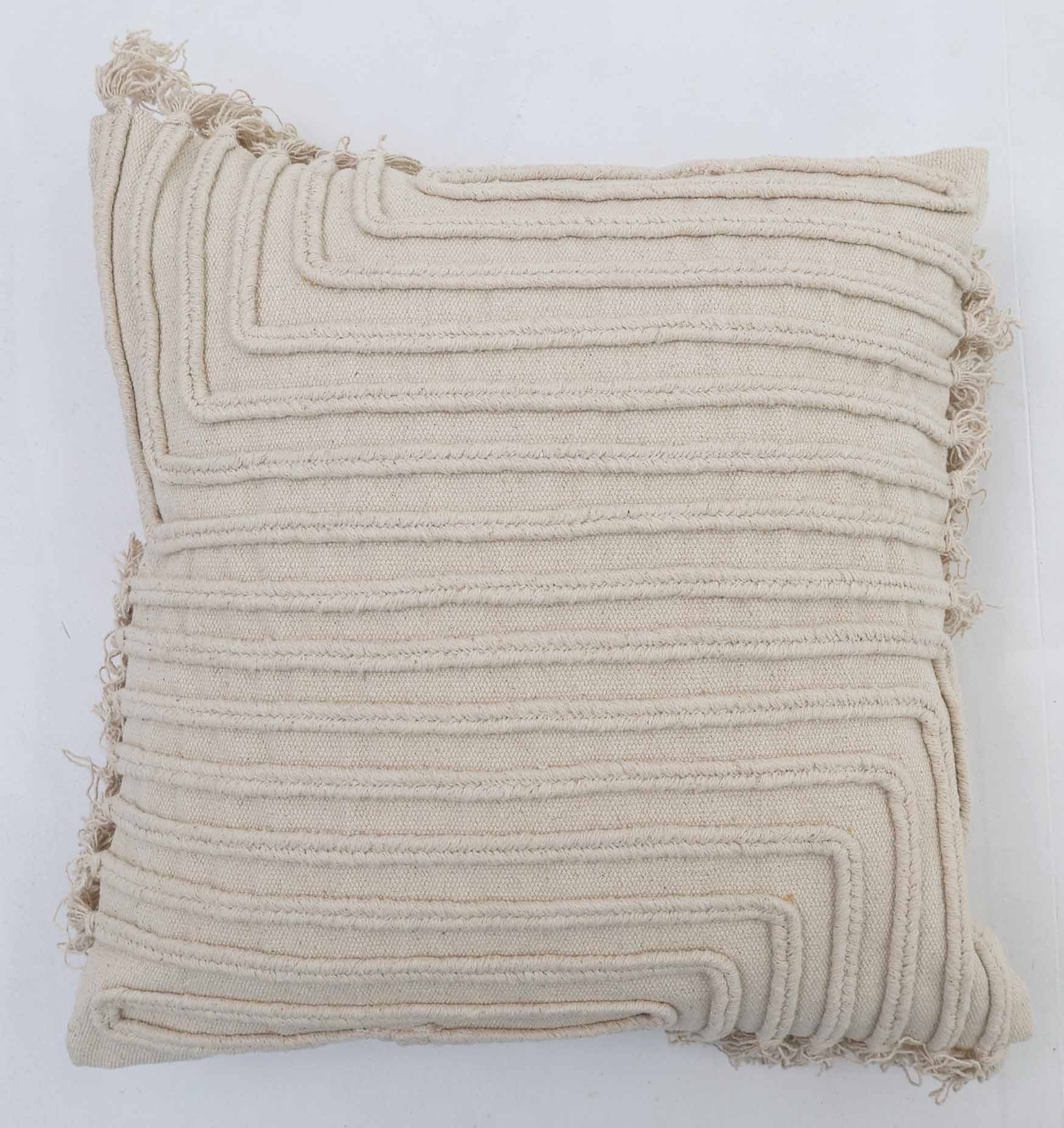 The Ramsha Home Decor Cushion Natural Color - CS 302 (45x45cm) features textured, raised linear patterns and subtle fringe edges, displayed against a white background. From Ramsha Home: Luxury Rugs & Home Furnishings Brand In The UAE.