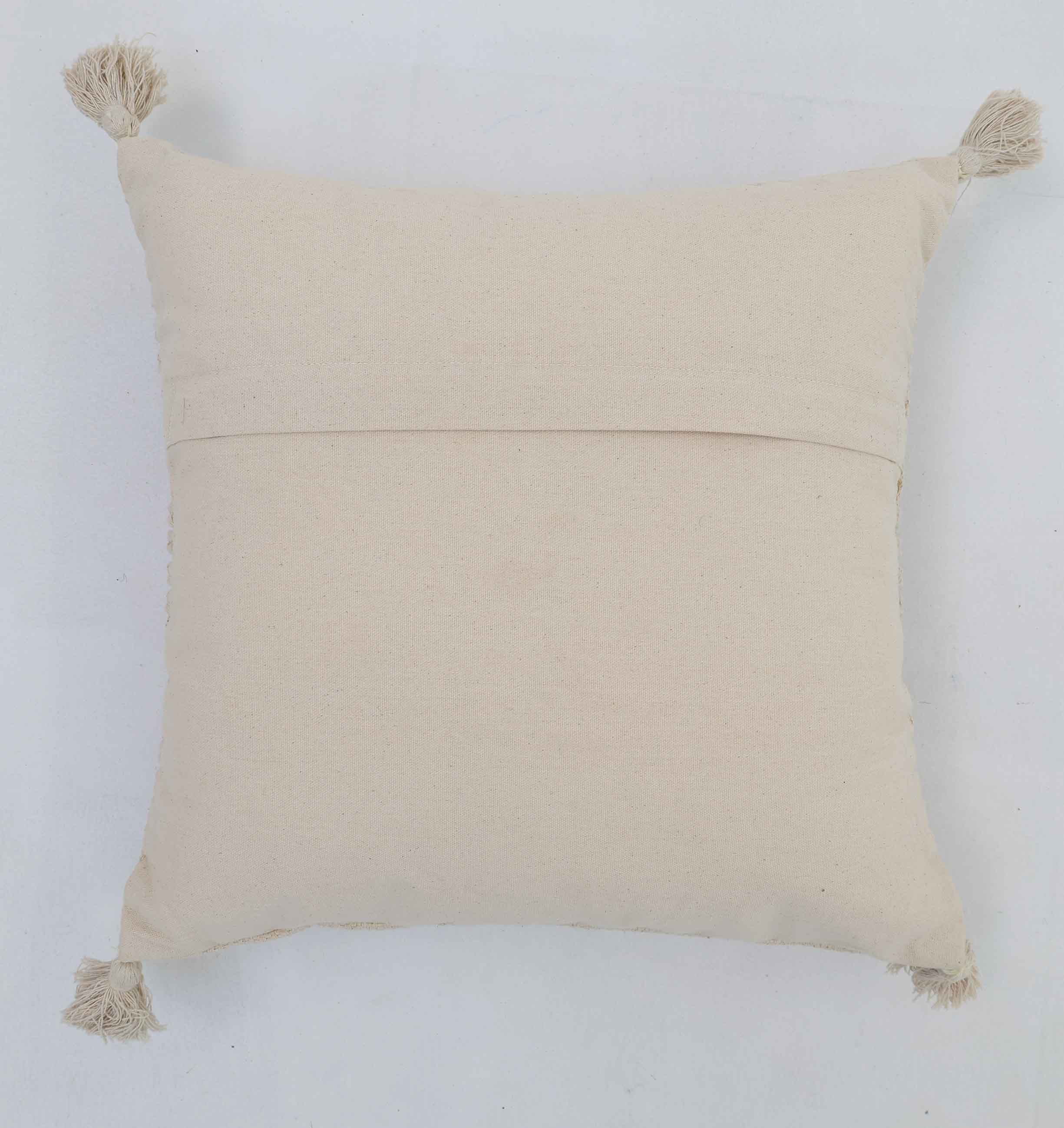 The Ramsha Home Decor Tassel Cushion Natural Color - CS 304 (45x45cm) features corner tassels and an overlapping back flap, ideal for home decor. From Ramsha Home: Luxury Rugs & Home Furnishings Brand In The UAE. Displayed on a white background.