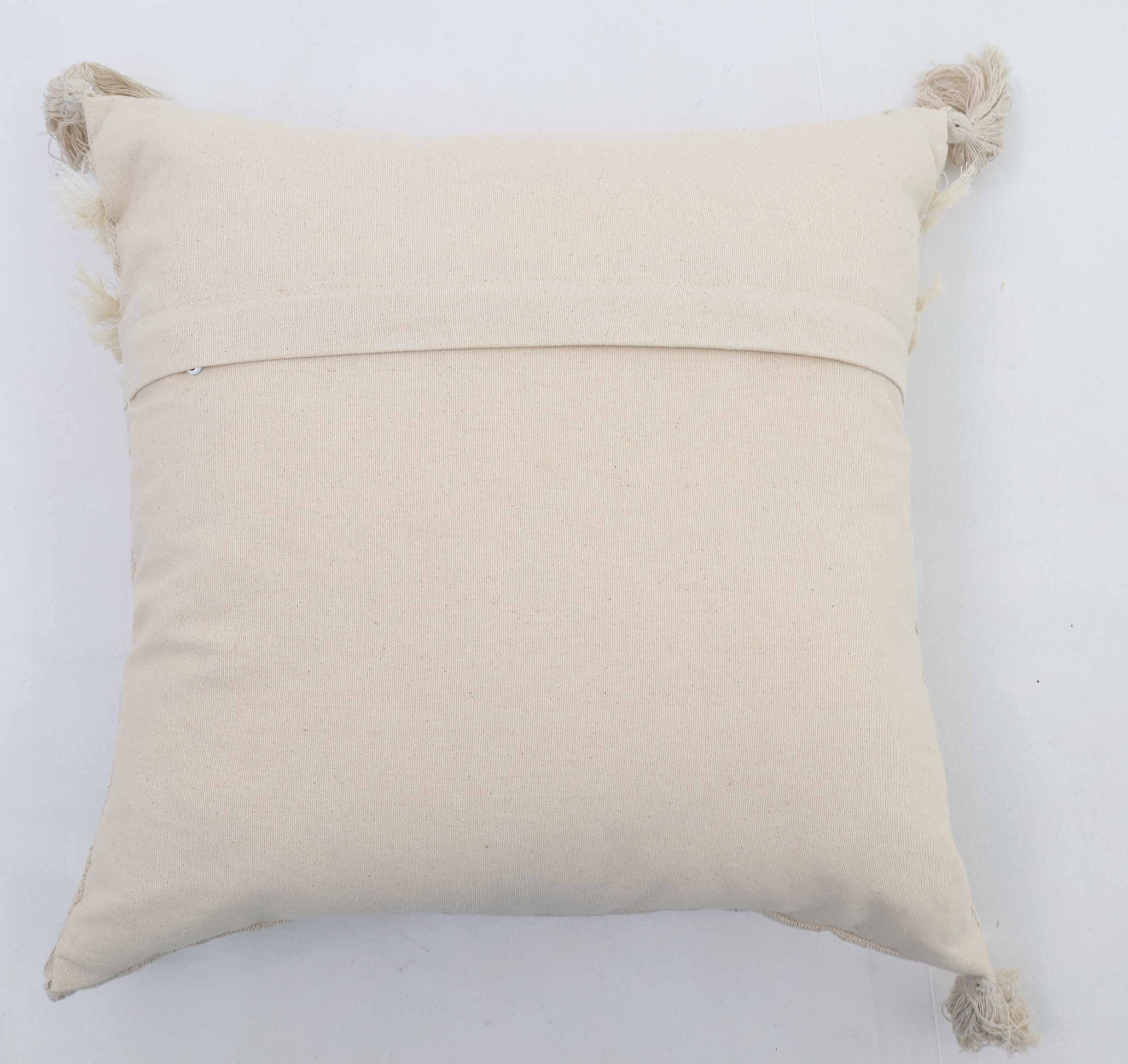 The Ramsha Home Decor Tassel Cushion Natural Color - CS 305 (45x45cm) features frayed corner tassels and a simple square design with a back seam, making it a subtle, stylish touch for your home decor from the UAE's luxury furnishings brand.