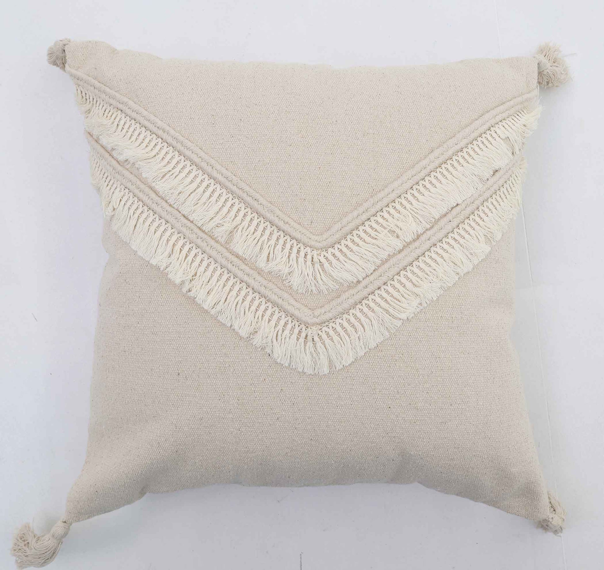 The Ramsha Home Decor Tassel Cushion CS 305 (45x45cm) in natural beige features two V-shaped rows of white fringe and corner tassels—stylish and perfect for your decor. From Ramsha Home, luxury rugs & furnishings brand in the UAE.