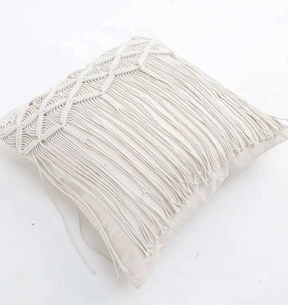 The Ramsha Home Natural White Macrame Sofa Cushion - CS 309 features a square decorative cover with detailed patterns and long fringe, shown on a plain white background.