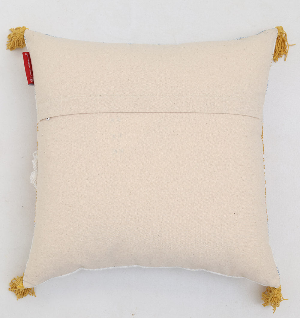 The Ramsha Home Multi Color Home Decor Cushion - CS 315 A is a square beige cushion with yellow tassels and a back pocket, shown on a light background.
