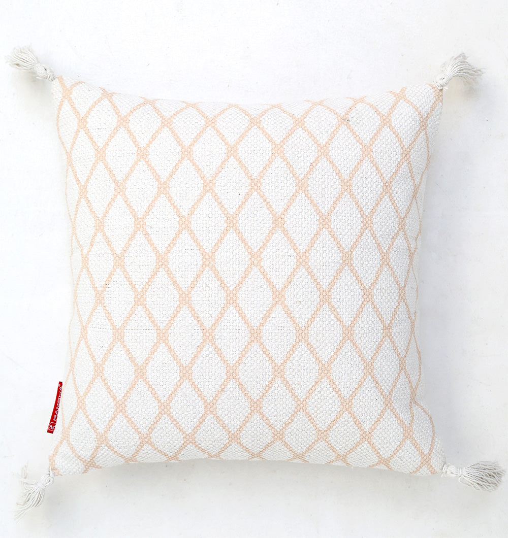 The White and Peach Color Cushion 45x45 cm CS 316 by Ramsha Home features a subtle diamond lattice pattern, white tassels on each corner, and a small red fabric tag, adding elegance to any space. Perfect for luxury decor in the UAE.