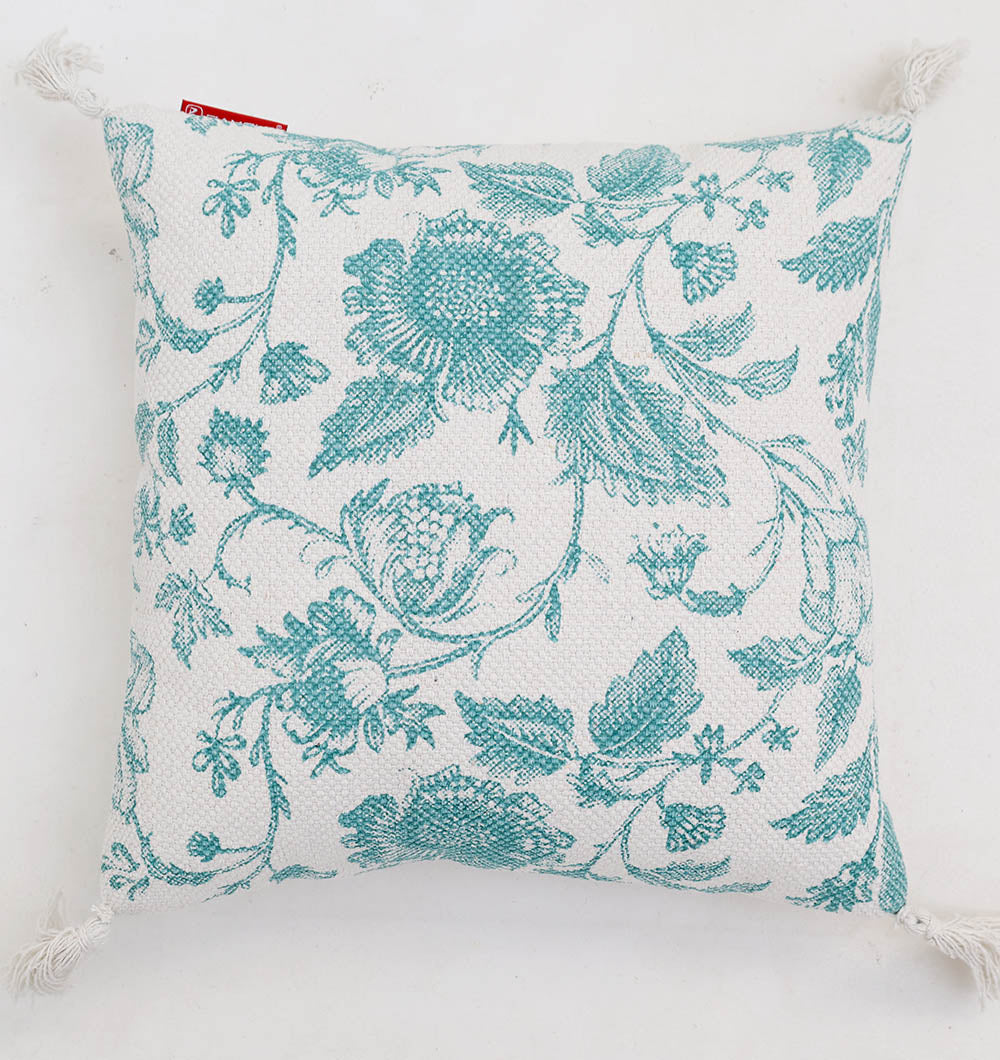 The Blue Color Floral Print Cotton Cushion 45x45 cm (CS 317) from Ramsha Home features delicate blue floral embroidery and corner tassels, ideal for enhancing your home décor. Shown on a white background.