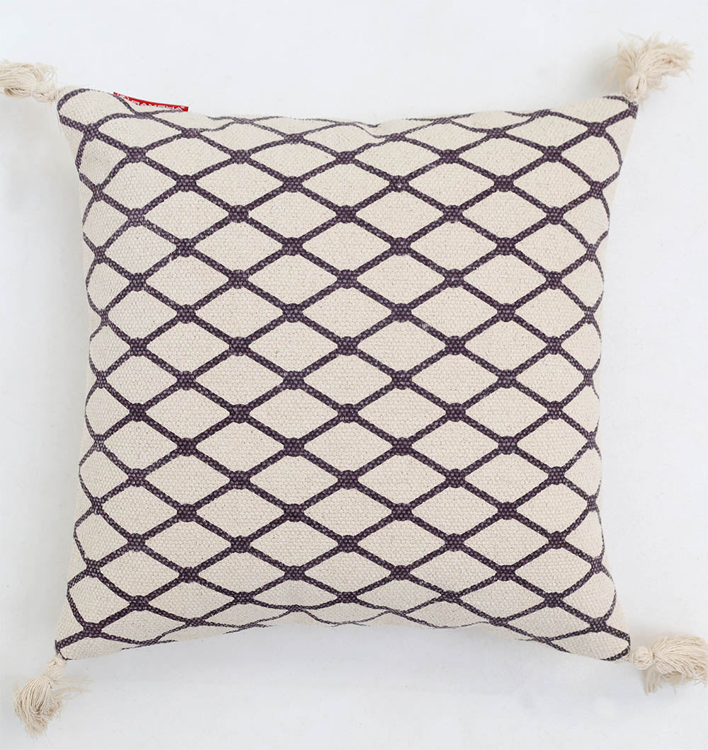The Ramsha Home Cream & Brown Printed Cotton Cushion 45x45 cm CS 318 features a black diamond lattice on cream and brown, finished with tasseled corners, making it a standout piece for your decor.