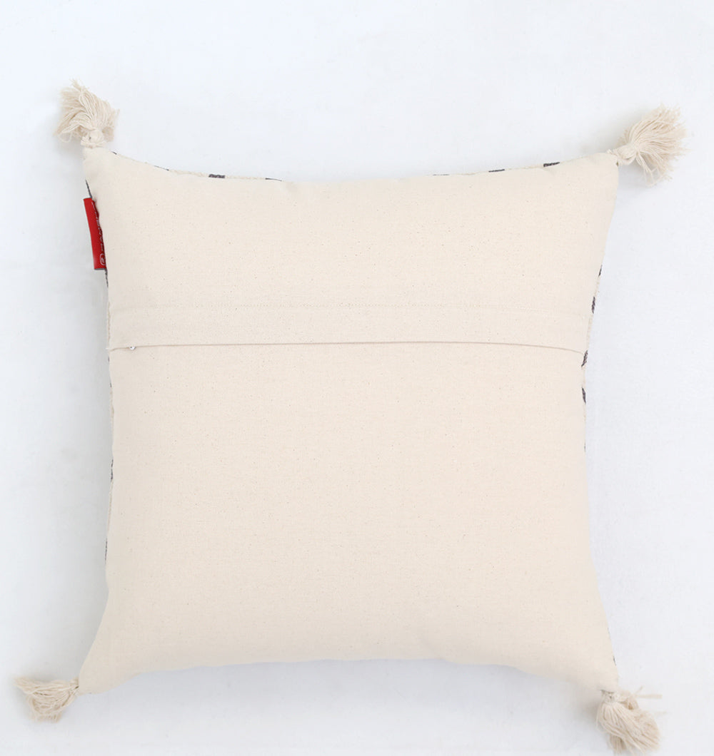 The Cream & Brown Printed Cotton Cushion 45x45 cm (CS 318) from Ramsha Home features a square design, cream and brown print, four corner tassels, and a horizontal envelope closure; shown on a white background.