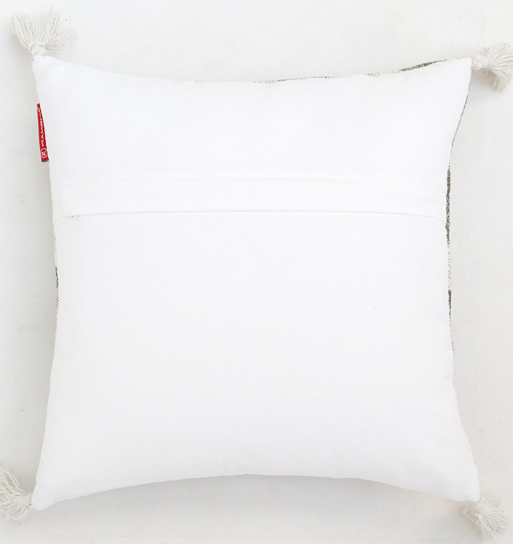 The Ramsha Home White and Grey Printed Cotton Cushion 45x45 cm (CS 320) features a simple design with white tassels at each corner, a back seam, and a small red tag, shown on a light background.