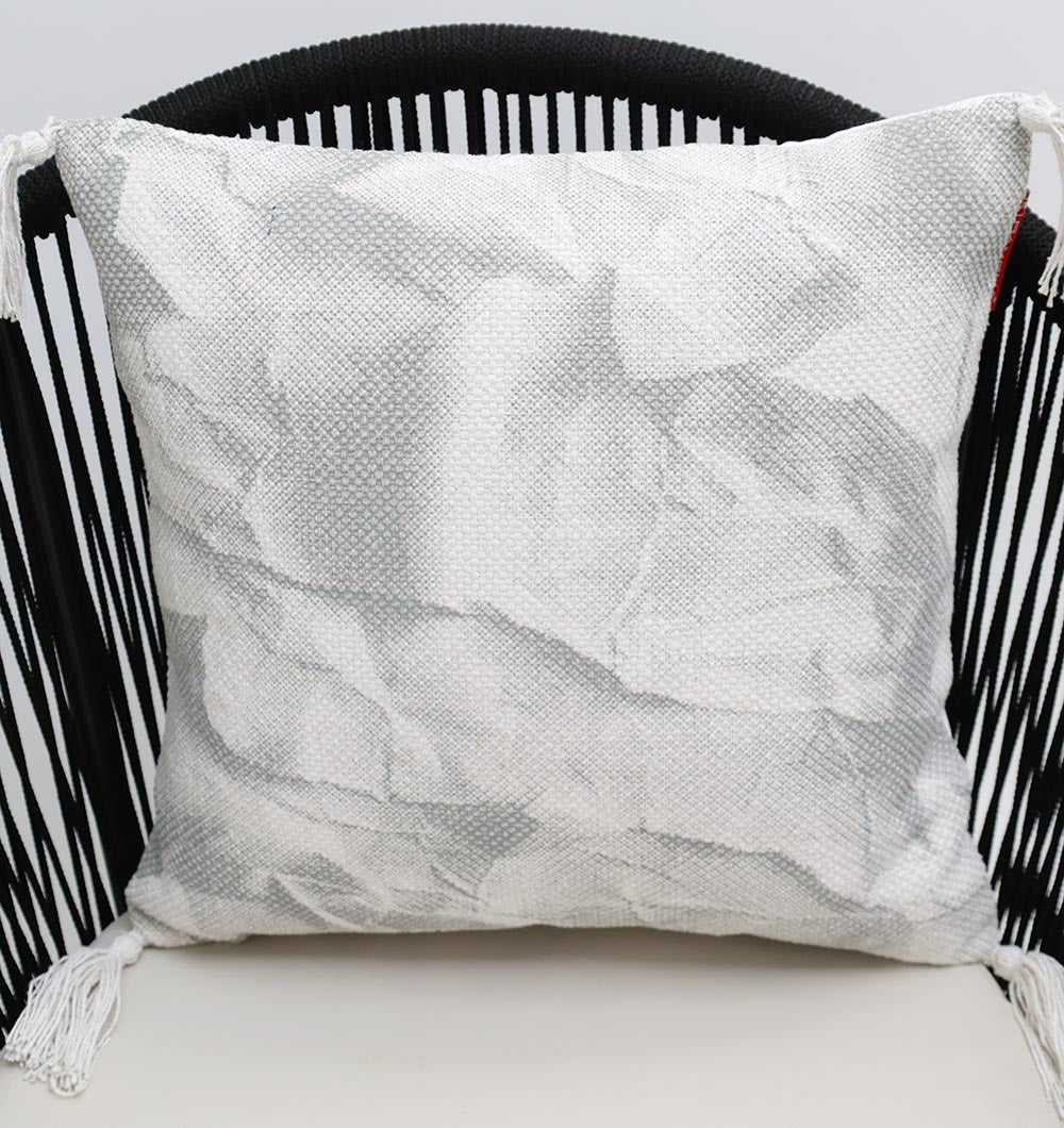 The Ramsha Home White and Grey Printed Cotton Cushion 45x45 cm (CS 321) is a stylish decorative accent, featuring premium cotton with a subtle print, perfect for enhancing any space with luxury and charm.