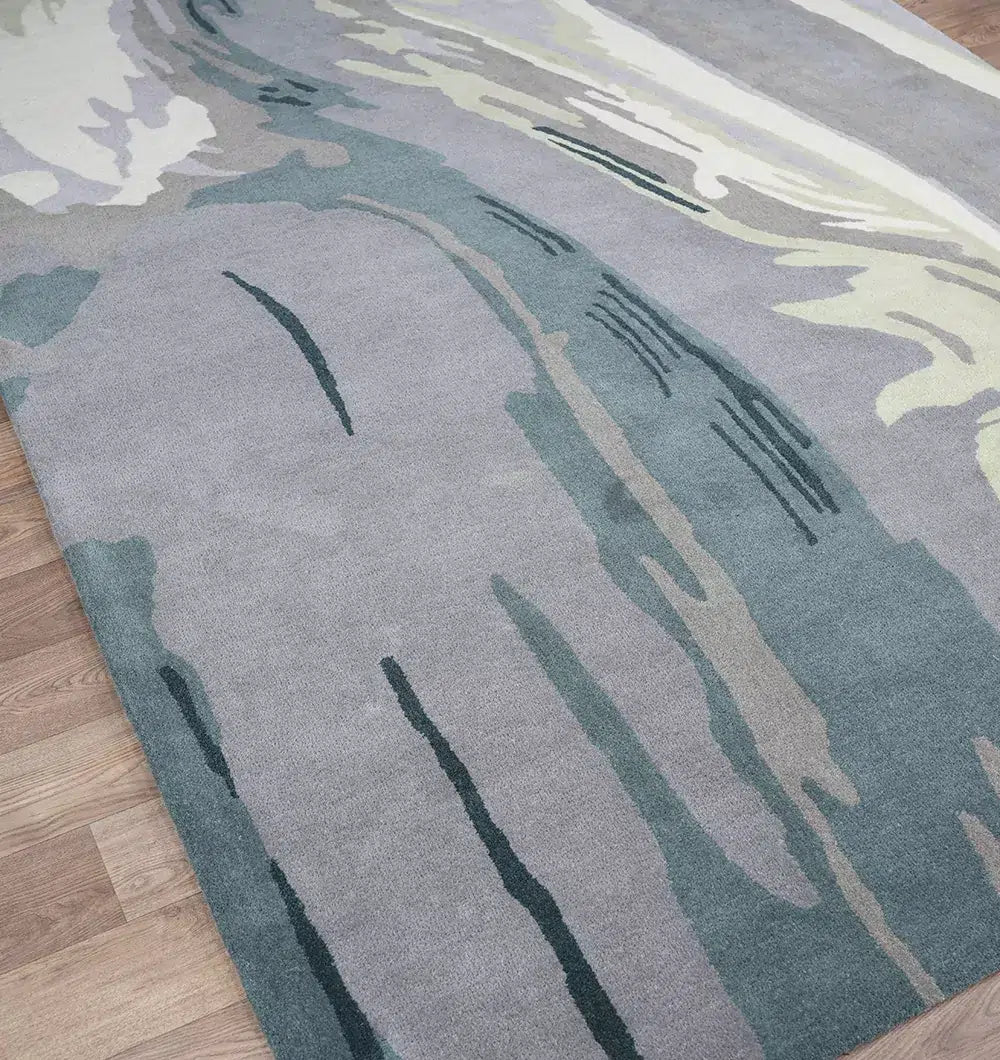 The Beautiful Hand-Tufted Rug - CWL 11 (200x300cm) by RAMSHA HOME features abstract wavy patterns in gray, blue, cream, and green—ideal as a statement blue grey area rug for any space.