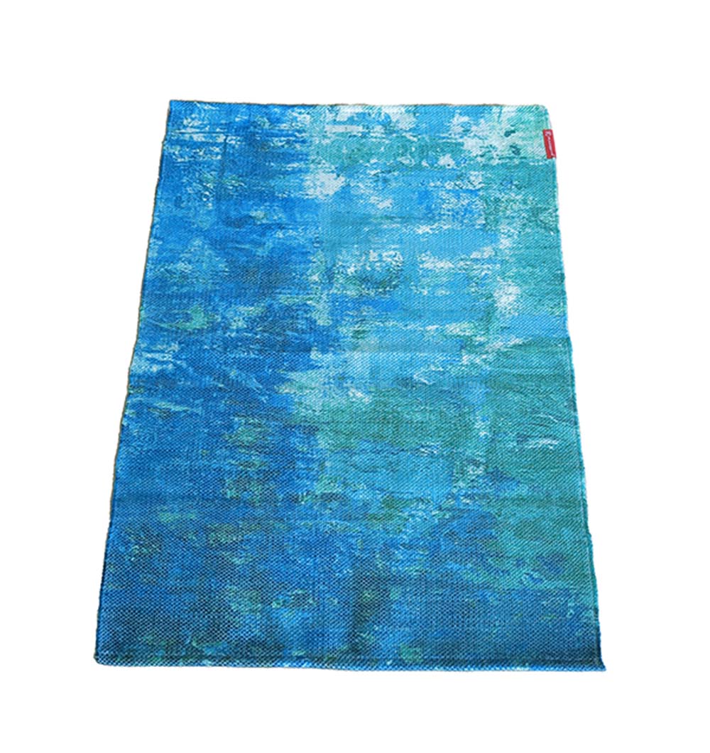 The RAMSHA HOME Gradient Printed Durry Multi Color DD-012 is a modern area rug with a textured pattern in blue and teal shades, accented by a small red tag on the upper right corner and shown on a white background.