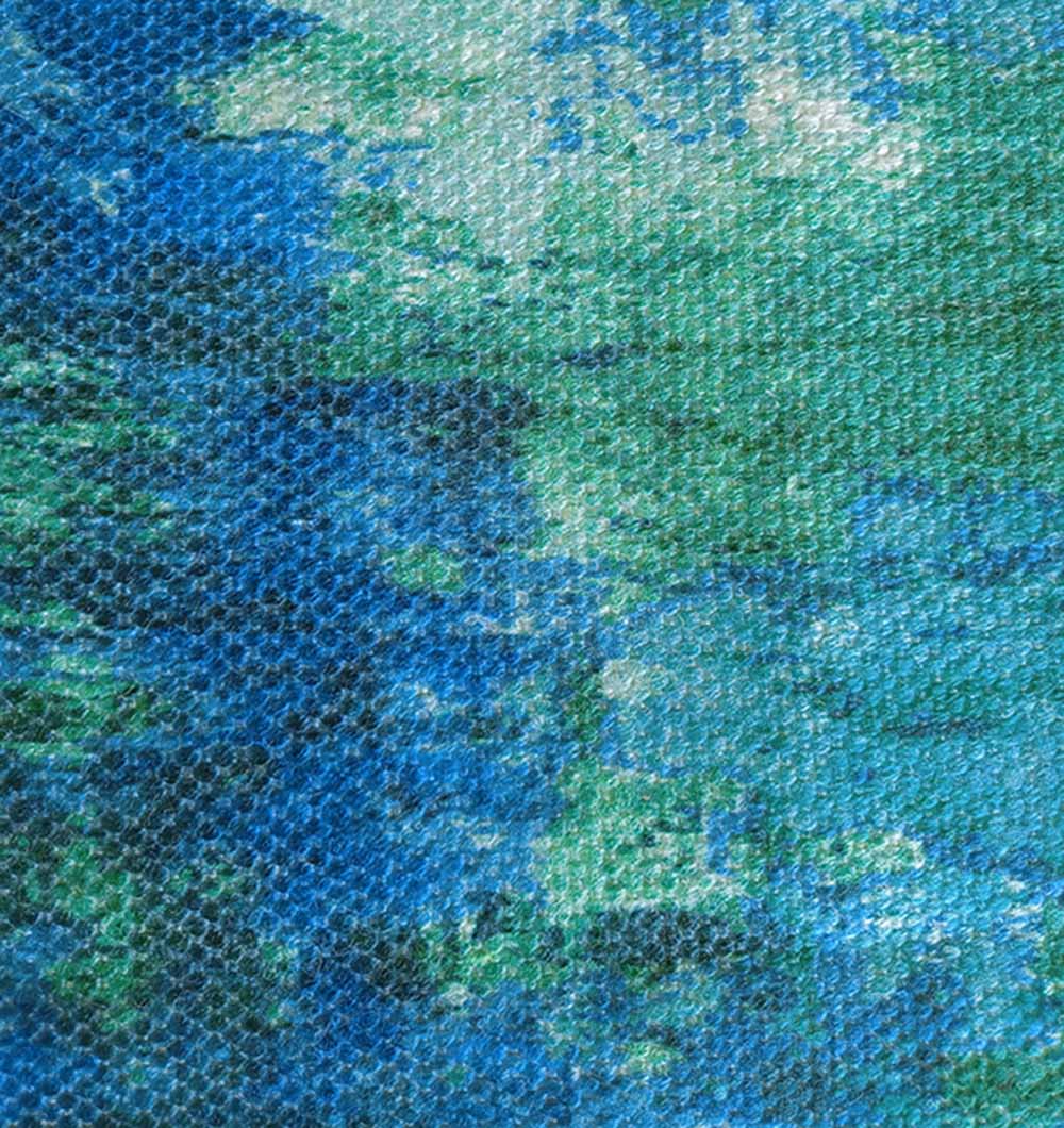 Close-up of RAMSHA HOME's Gradient Printed Durry Multi Color DD-012, featuring an abstract blue, green, and white pattern with visible mesh and woven texture for a modern rug look.