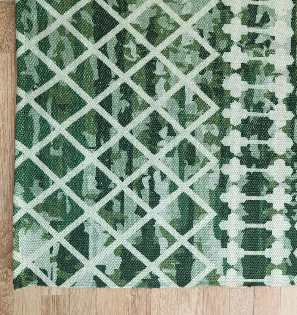The RAMSHA HOME Emerald Mosaic Digital Printed Rug for Living Room DD-046 features intersecting diagonal lines and geometric shapes in emerald green and white, creating a striking mosaic pattern on any wooden floor.