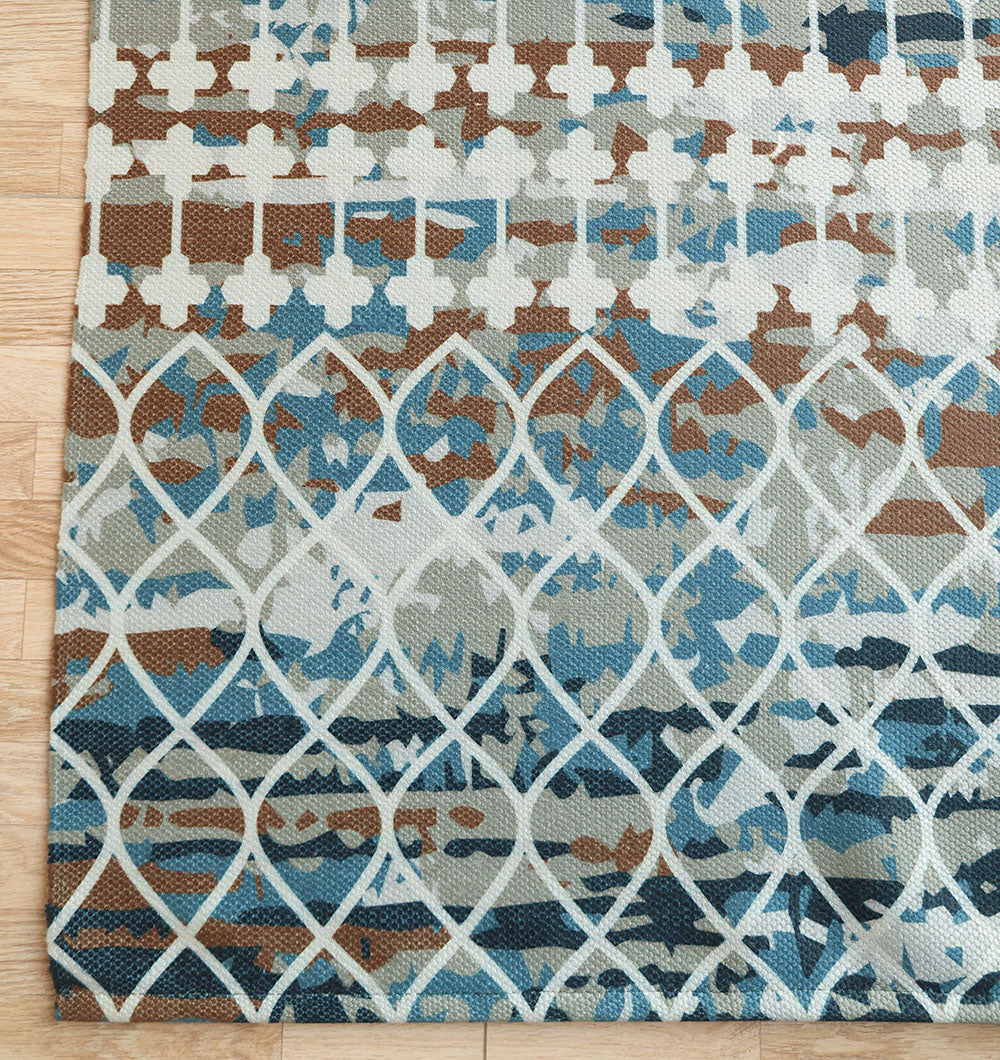 The RAMSHA HOME Modern Mosaic Digital Printed Rug for Living Room DD-047 features abstract lattice and cross patterns in blue, brown, and beige, adding a stylish contemporary touch to your light wooden floor.