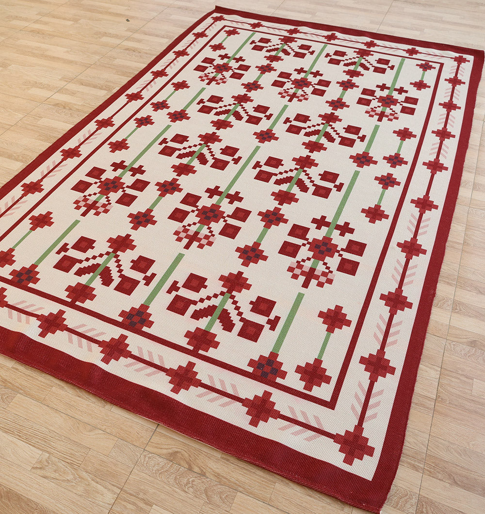 The RAMSHA HOME Traditional Red Floral Digital Printed Rug – Bohemian Area Rug DD-048 features cream, red, and green geometric floral patterns with a thick red border, shown here on a light wood floor.