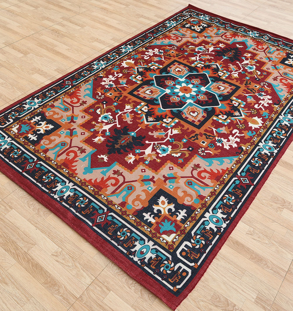The RAMSHA HOME Bohemian Floral Medallion Printed Area Rug DD-050 features vibrant geometric and floral designs in red, blue, white, and mustard on a light wood floor.