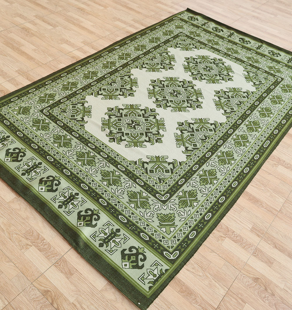 The RAMSHA HOME Contemporary Tribal Digital Print Rug DD-053 (145x240 cm) features green and white Persian-style geometric and floral patterns with multiple borders, creating a timeless look on a light wood floor.