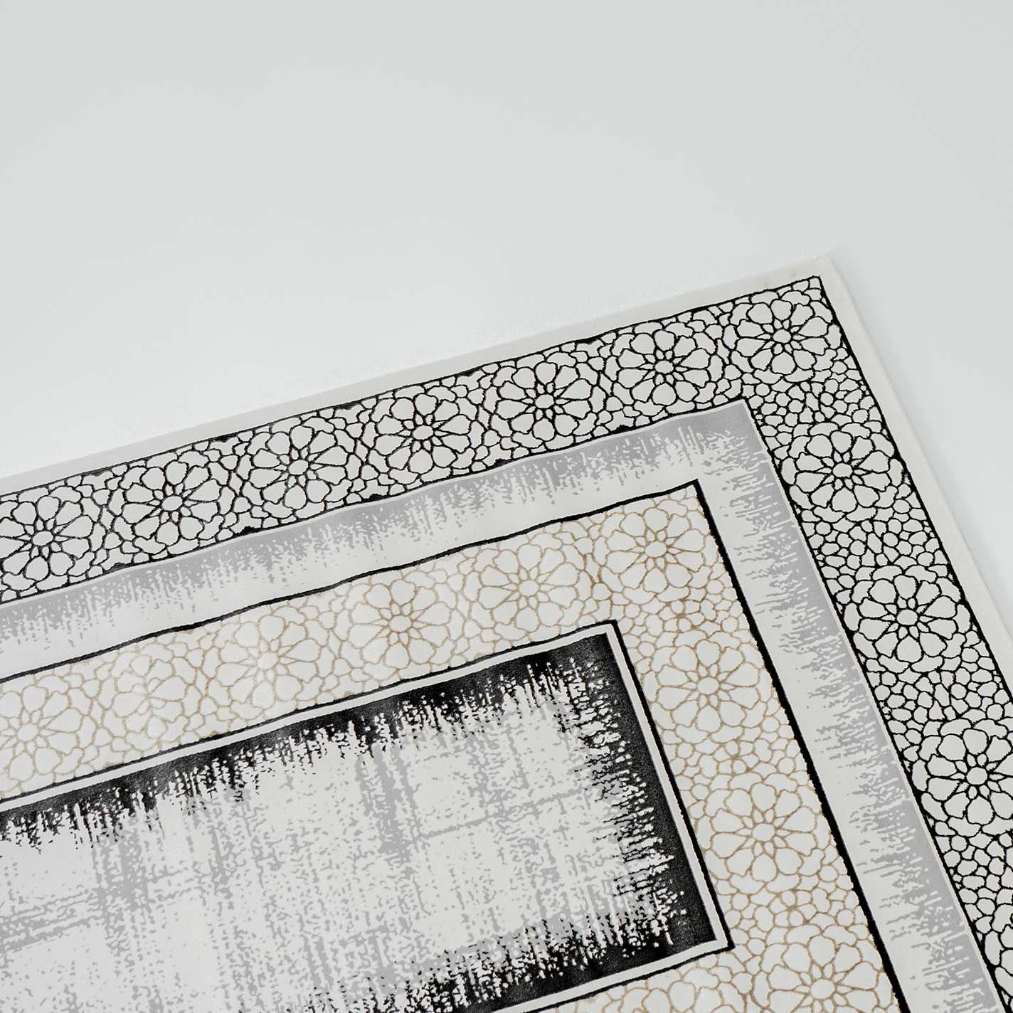 Close-up of the RAMSHA HOME Grey Color ND81A BARCELONA Decor Area Rug, showing its modern black and beige floral border with a distressed center pattern on a white background.