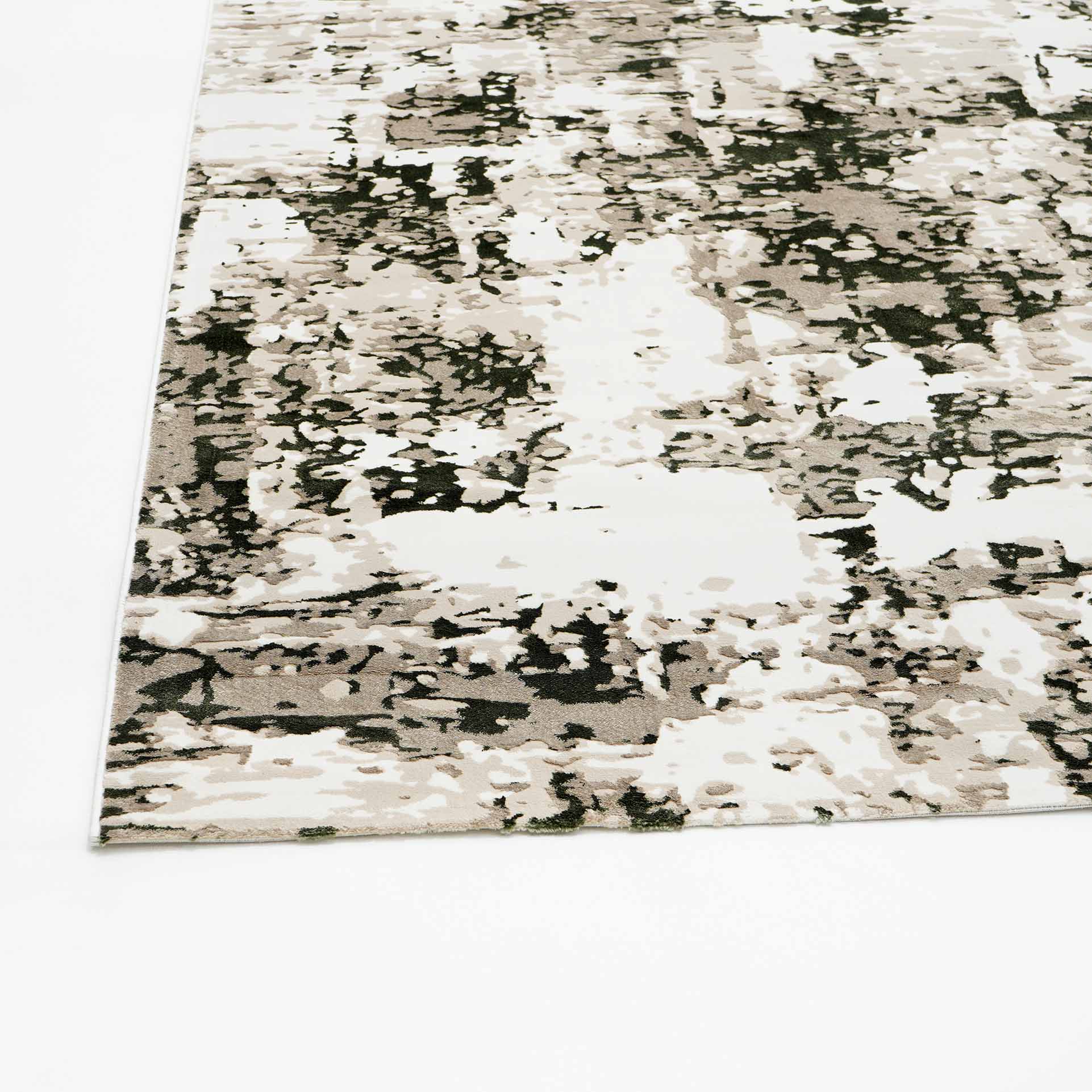 A close-up of the RAMSHA HOME Multi Colored Geometry Turkish Carpet MZ61E, a modern machine-made rug with an abstract, textured black, gray, and white design, shown on a white background.