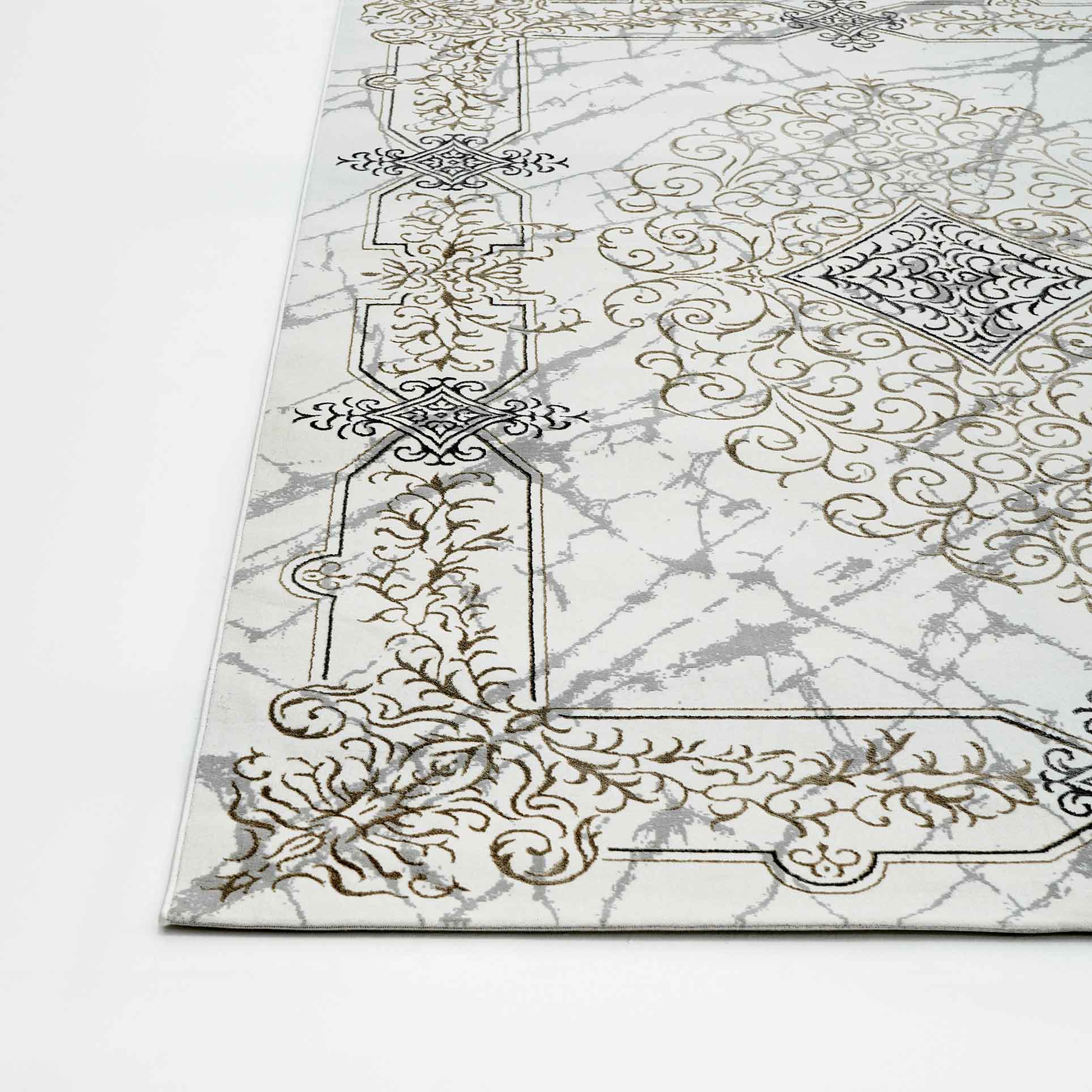 The RAMSHA HOME Beige Color Polyester NK33C Area Rug features ornate gold and gray scrollwork with intricate designs on a marble-like background, displayed elegantly on a white floor.