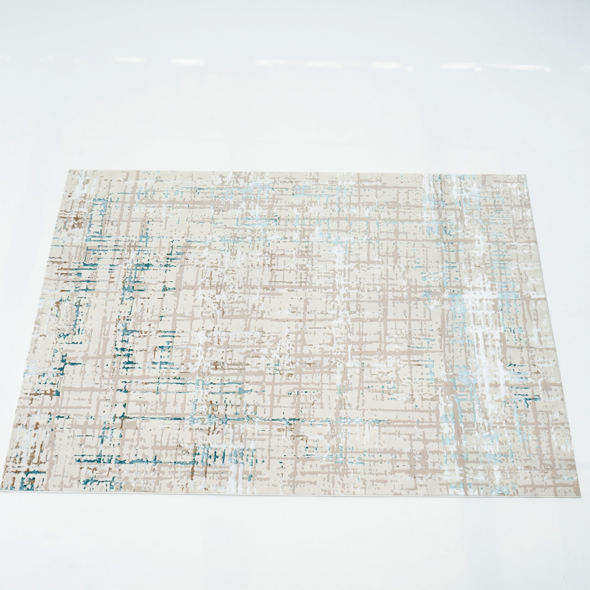 The RAMSHA HOME Cream Colored Turkish Carpet MZ24G BARCELONA features a rectangular abstract design in blue and gray on a beige background, showcased on a white surface.