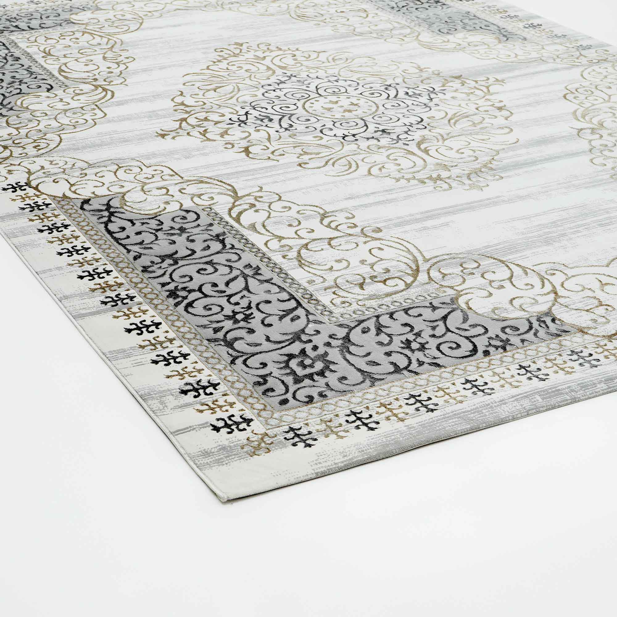 The RAMSHA HOME Light Grey Color NK36B 100% Polyester Silk Rug features ornate gold and black swirling patterns with decorative borders on a white and light grey background, shown flat on a white floor.