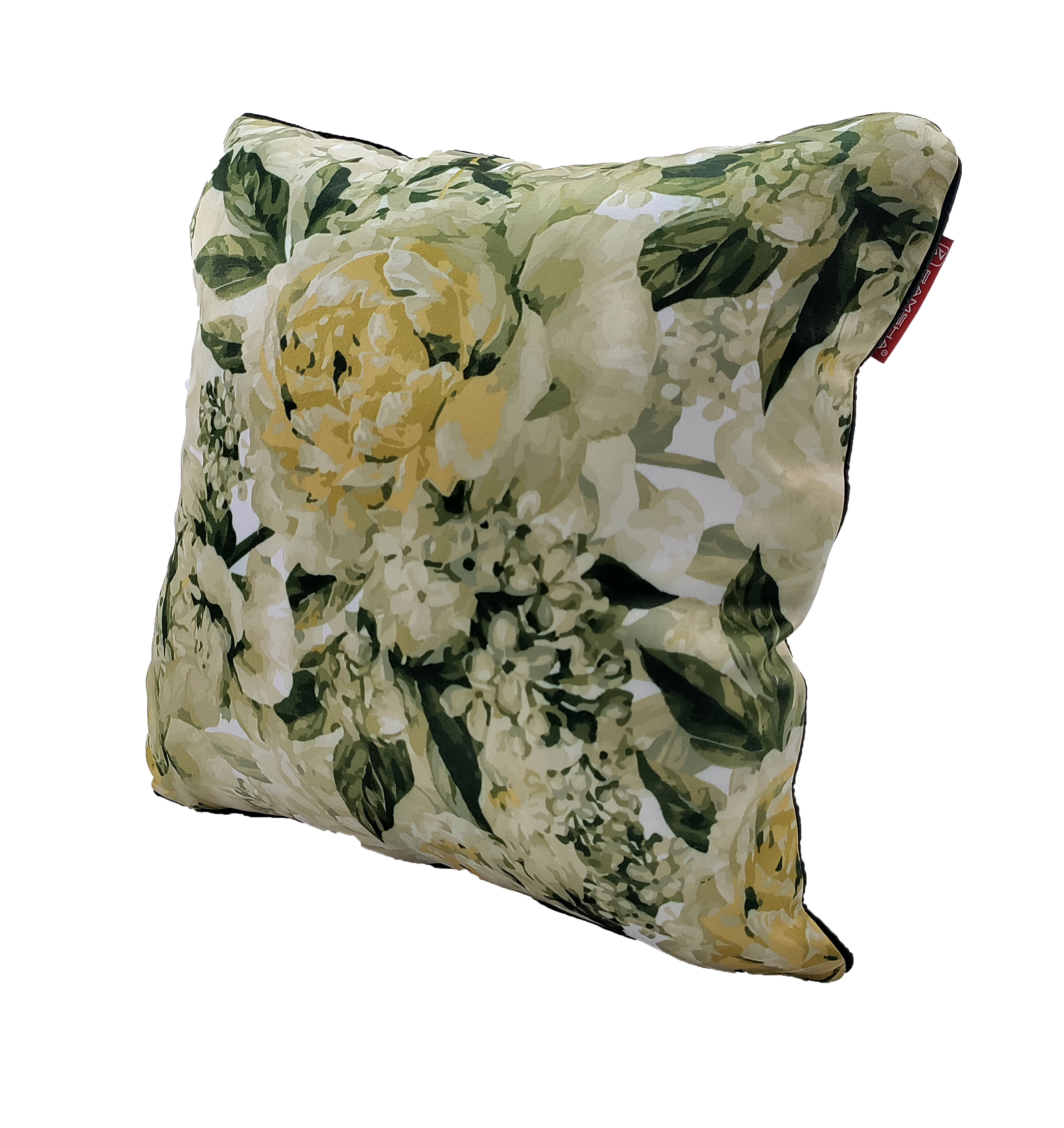 The RAMSHA HOME Floral Printed Multi Color Cushion features yellow and white flowers with green leaves on a light background, a soft plush texture, and a small red tag—perfect for home decor.