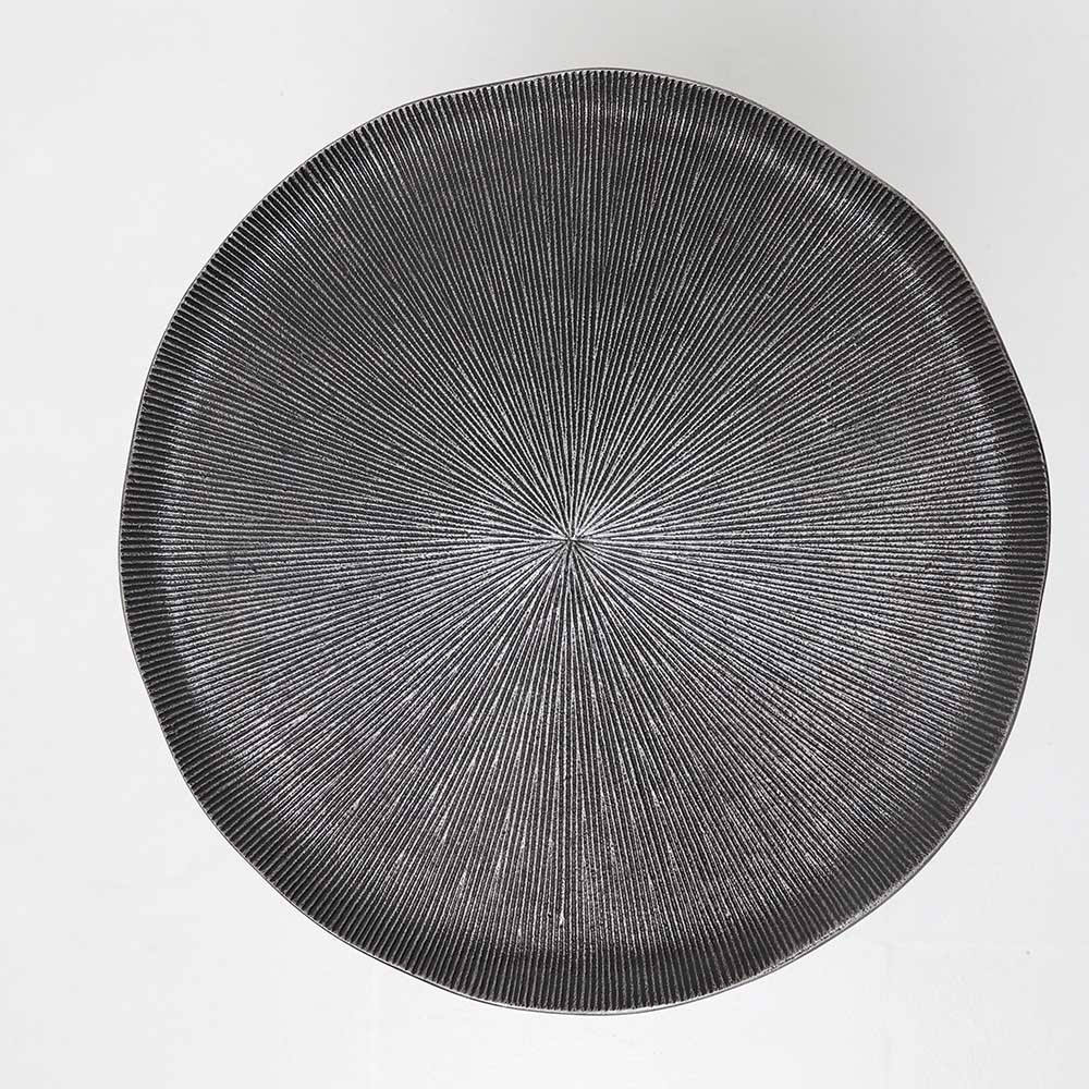 The RAMSHA HOME Modern Black Metal Side Table features a round, textured top with radiating lines and a pyramid base, captured from above against a white background, echoing elegant contemporary style.