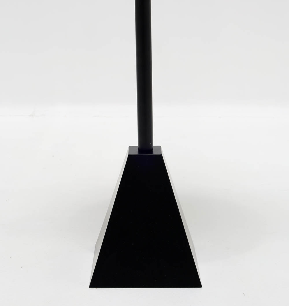 The RAMSHA HOME Modern Black Metal Side Table features a textured round top and a sleek pyramid base, creating a striking geometric look against a plain white background.