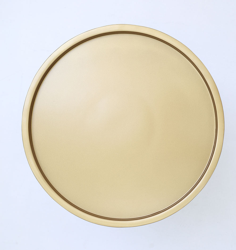 A round, smooth top of the RAMSHA HOME Luxury Iron Side Table – Golden Finish with Textured Design (model GH-085), viewed from above, showcases its brass antique look against a plain white background.