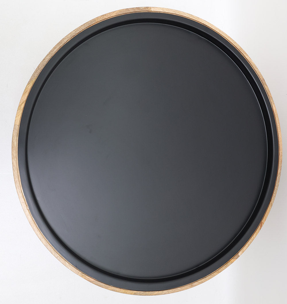 The RAMSHA HOME Modern Wooden & Iron Coffee Table – Round Slatted Design GH-093 features a black round tray top with a light wood rim, elegantly displayed on a white surface.