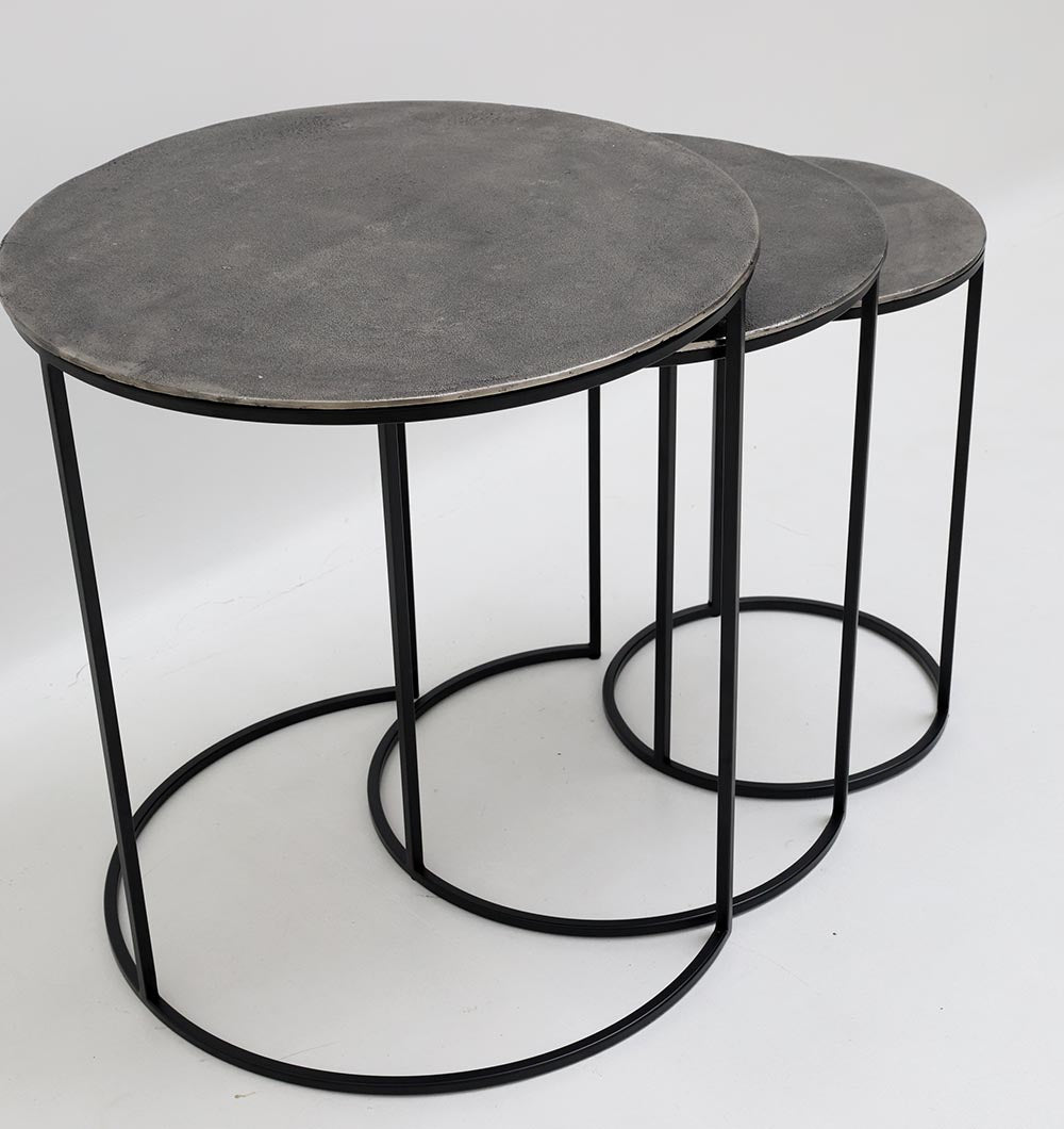 The RAMSHA HOME Set of 3 Modern Nesting Side Tables (Model GH-071) features round tables in antique brass finish with black iron bases, arranged by size to nest partially beneath one another on a plain white background.