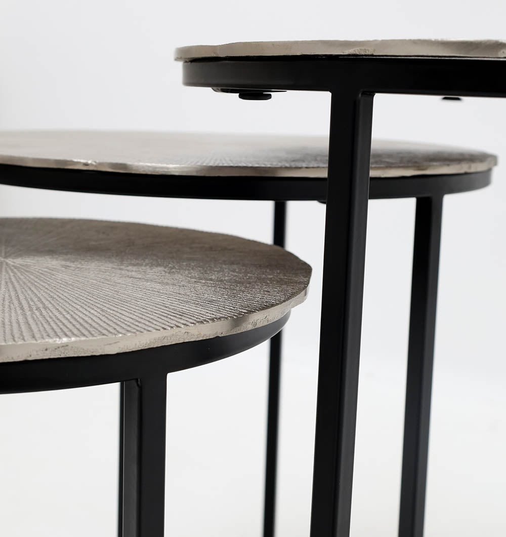 Close-up view of the RAMSHA HOME Set of 3 Modern Nesting Side Tables (GH-111-A) featuring antique brass-finished textured tops and grey iron bases, arranged at varying heights against a plain white background.