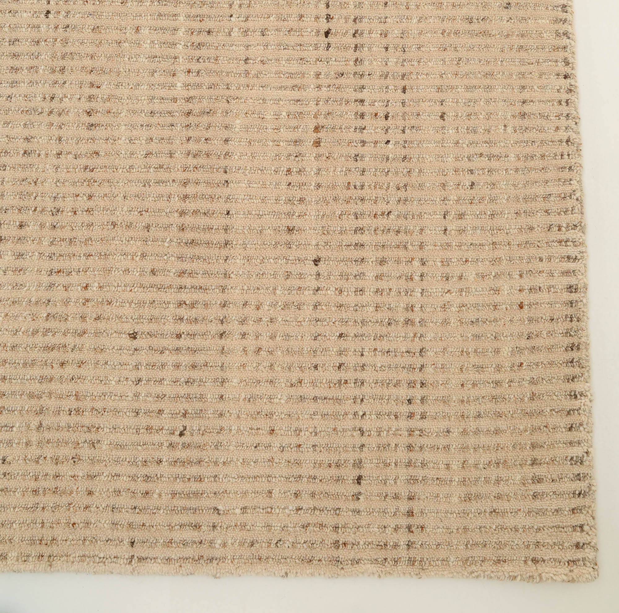 The RAMSHA HOME Handmade Natural Wool Rug – Textured Beige Area Rug (HLR-002) features a minimalist checkered pattern and visible texture, shown laid flat on a light floor.