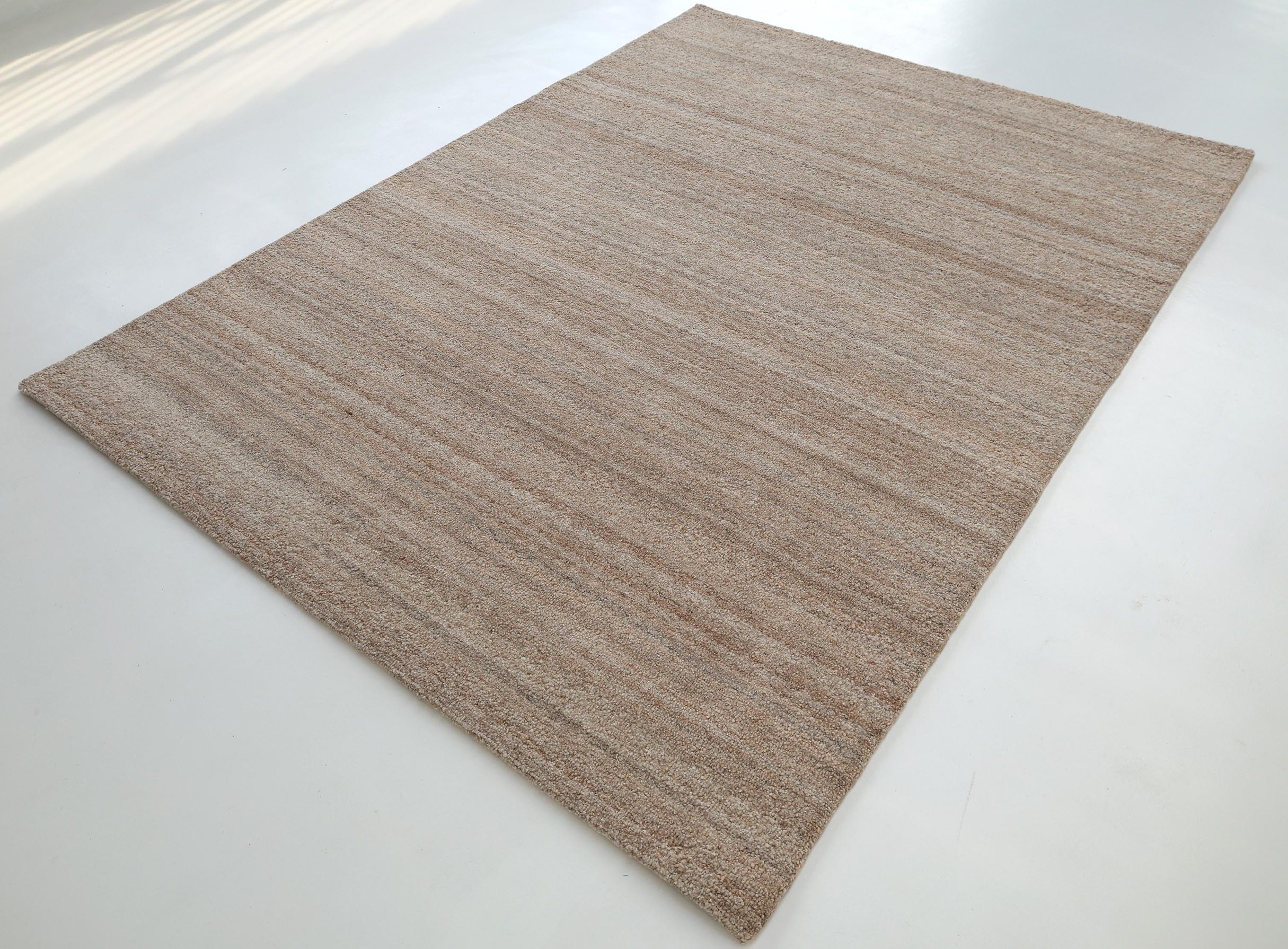 The RAMSHA HOME Handmade Natural Wool Rug – Textured Beige Area Rug (HTP 27) features subtle horizontal lines, perfect for bright spaces with light floors.