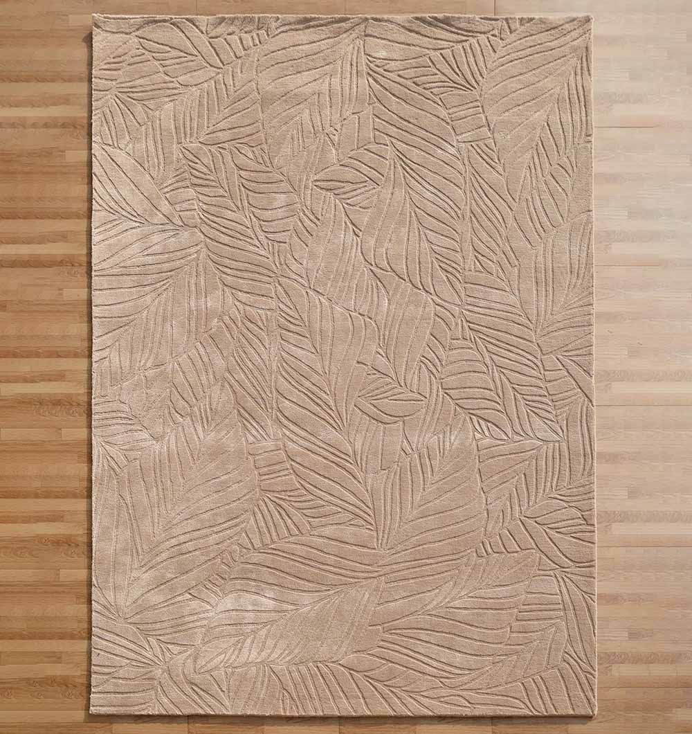 The RAMSHA HOME Rectangle Shape Beige Color Handmade Area Rug - HTV 25 (200x300 cm) adds a subtle, natural touch to wooden floors with its neutral tone and embossed overlapping leaf pattern.