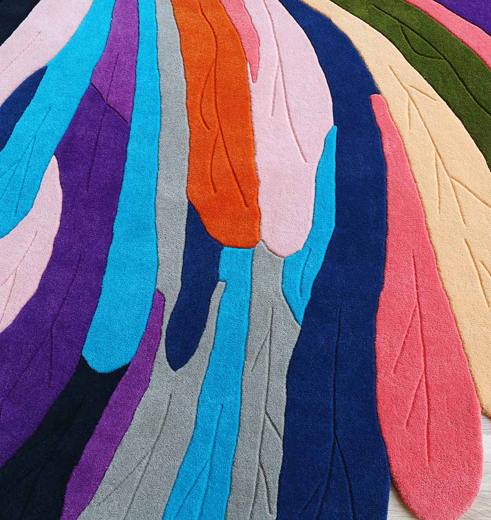 The RAMSHA HOME Multi Color Handmade Area Rug - HTW 113 (200x300 cm) features a vibrant mix of blue, purple, teal, gray, orange, pink, yellow, and green with hand-tufted abstract shapes and textured patterns resembling stylized leaves or feathers.