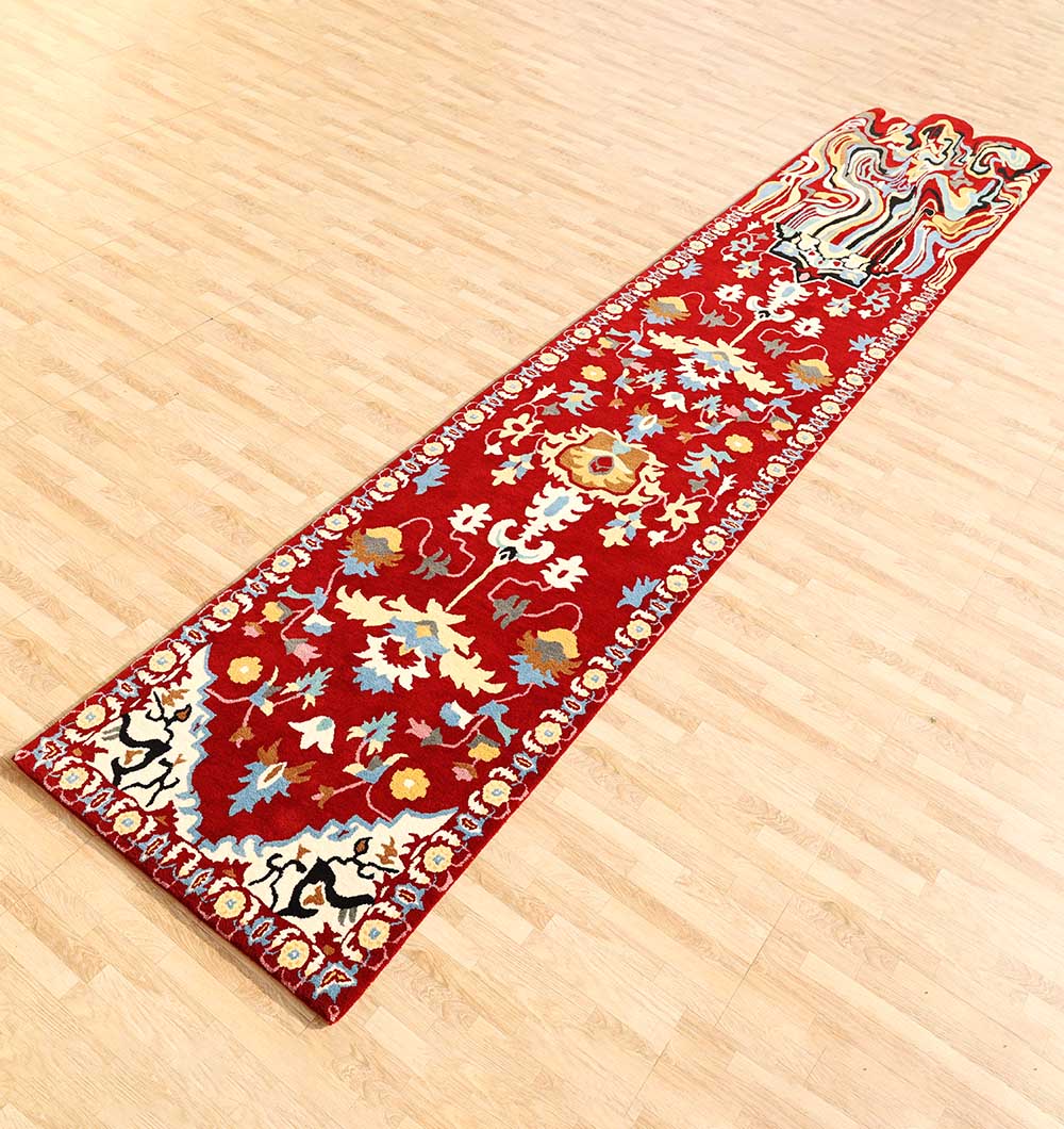 The RAMSHA HOME ‘Home Decor Handmade Carpet – HTW-118’ is a modern, red rectangular runner with colorful floral and vine patterns in blue, yellow, white, green, and cream—perfect for adding vibrant charm to light wood floors.