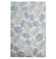 The RAMSHA HOME Home Decor Handmade Carpet – HTW-119 is a rectangular blue botanical wool rug with a white background, featuring hand-tufted construction and a stylish pattern of monstera and palm leaves.
