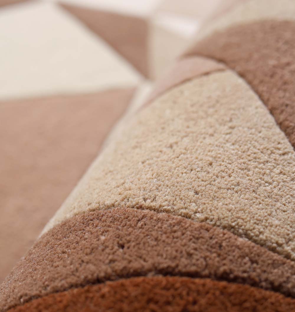 Close-up of the RAMSHA HOME Handmade Multicolor Geometric Pattern Round Area Rug HTW 129 (200cm), showcasing intersecting lines and shapes in brown, beige, and tan tones.