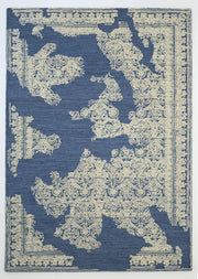 The RAMSHA HOME Blue Mosaic Handcrafted Luxury Area Rug-HTW 45 features beige ornate patterns over a blue base, with intricate decorative details resembling a European map for an elegant, artisanal touch.