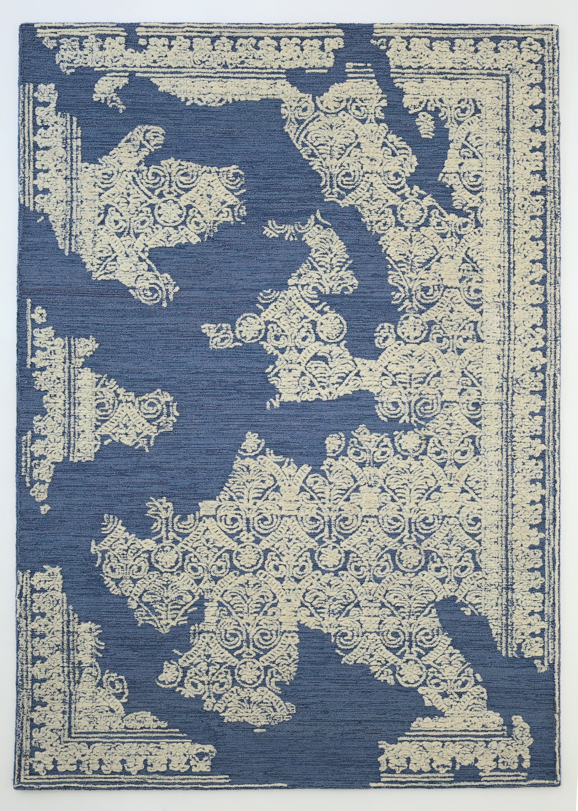 The RAMSHA HOME Blue Mosaic Handcrafted Luxury Area Rug-HTW 45 features beige ornate patterns over a blue base, with intricate decorative details resembling a European map for an elegant, artisanal touch.