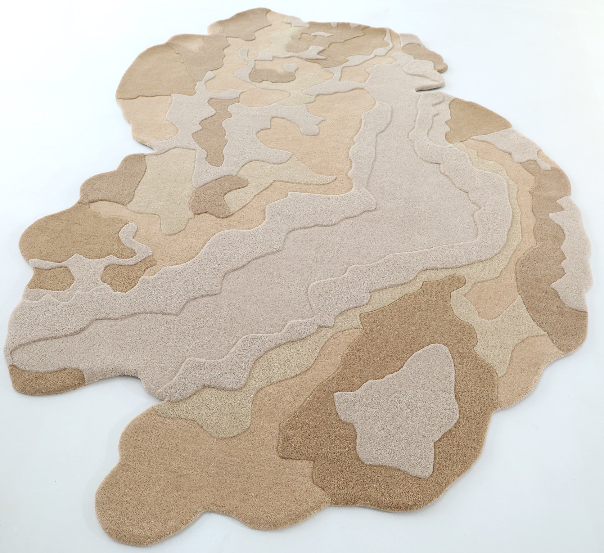 The RAMSHA HOME Contemporary Flow Area Handmade Rug HTWV-153 features layered abstract patterns in beige, tan, cream, and brown tones, resembling a topographic map, and is displayed on a plain white surface.