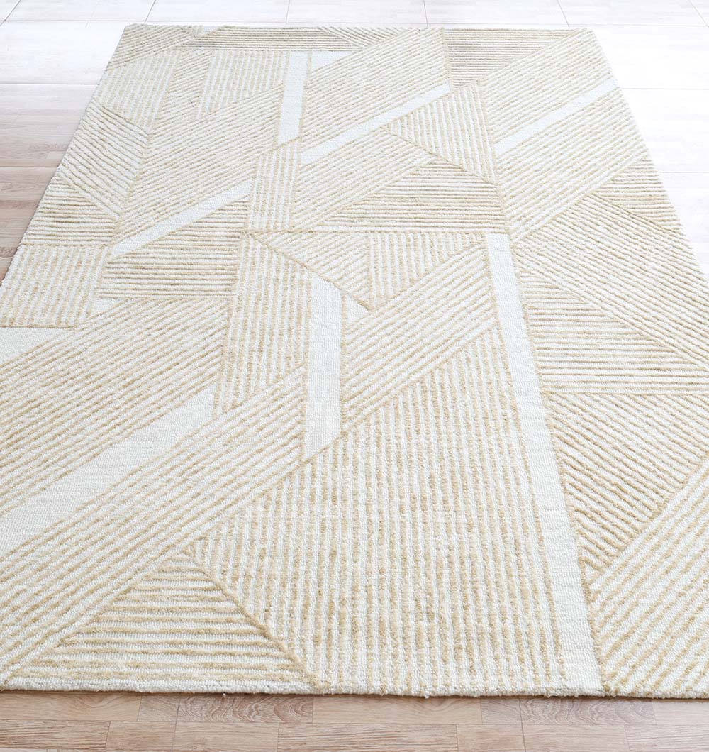 The RAMSHA HOME Multi Color Handmade Area Rug - HTW-91 (200X300 CM) with a beige and white geometric design is placed on a light wooden floor.