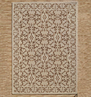 The Exquisite Multi Color Decor Handmade Rug - HTW 99 (300x400 CM) by RAMSHA HOME, featuring a beige and brown floral vine design with a decorative border, is placed on a light wood floor.